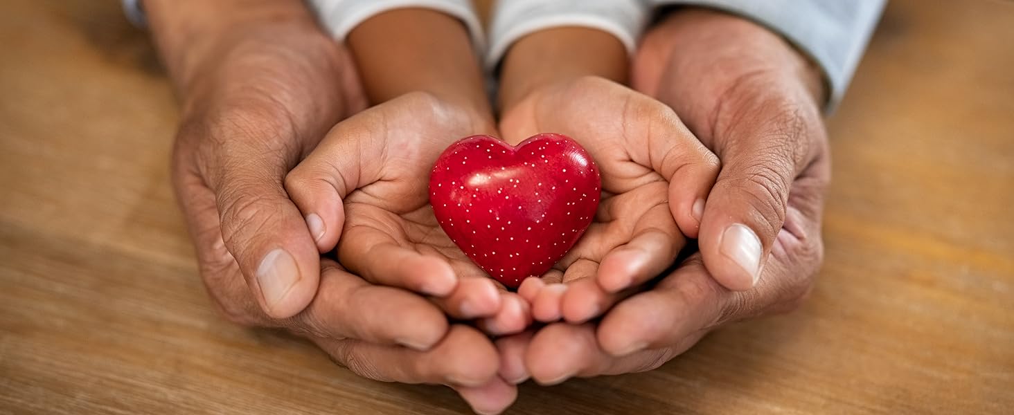 hands holding a red wooden heart
