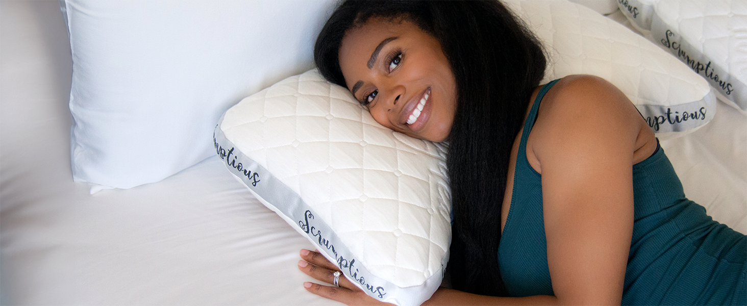 Smiling woman resting on ergonomic cooling pillow